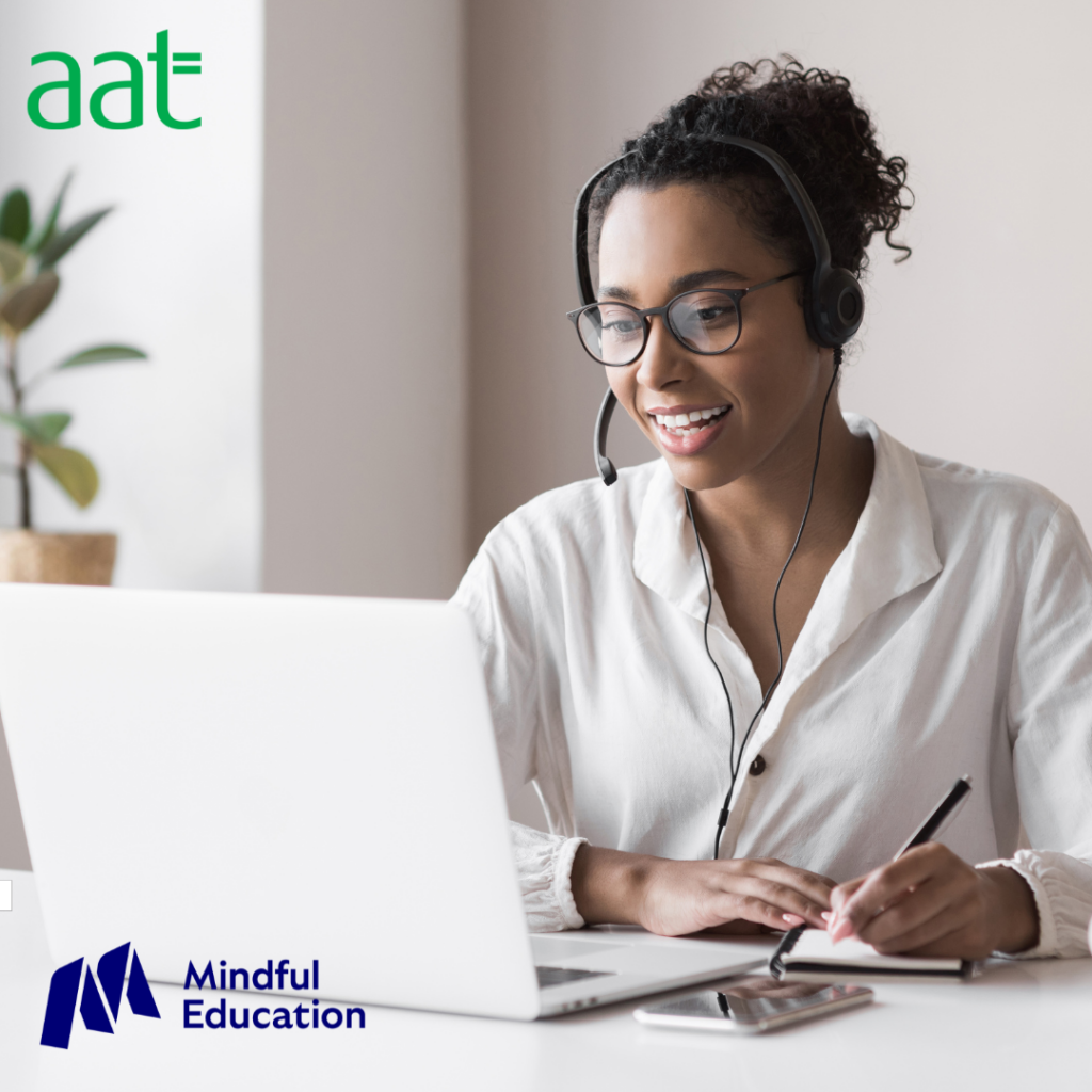 Female on laptop studying AAT Level 2