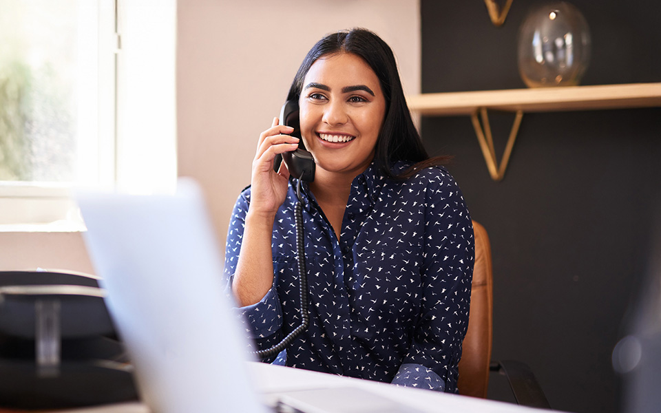 female on telephone in an office environment