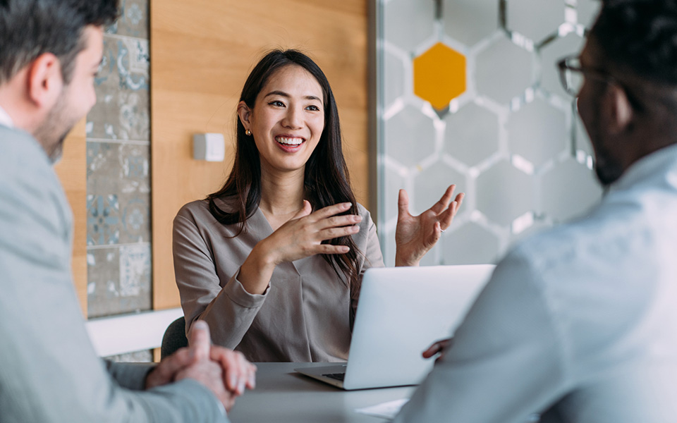 Female leader in project discussions with colleagues