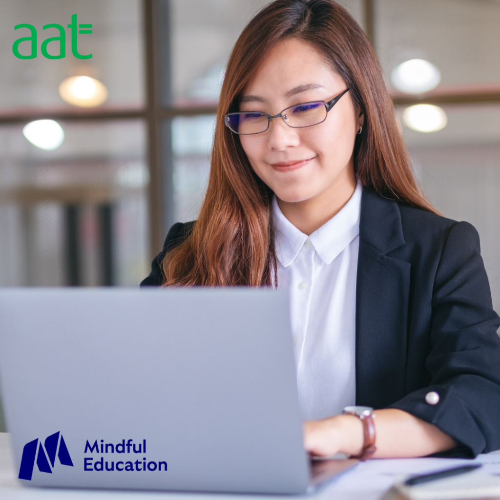 Female with glasses on laptop