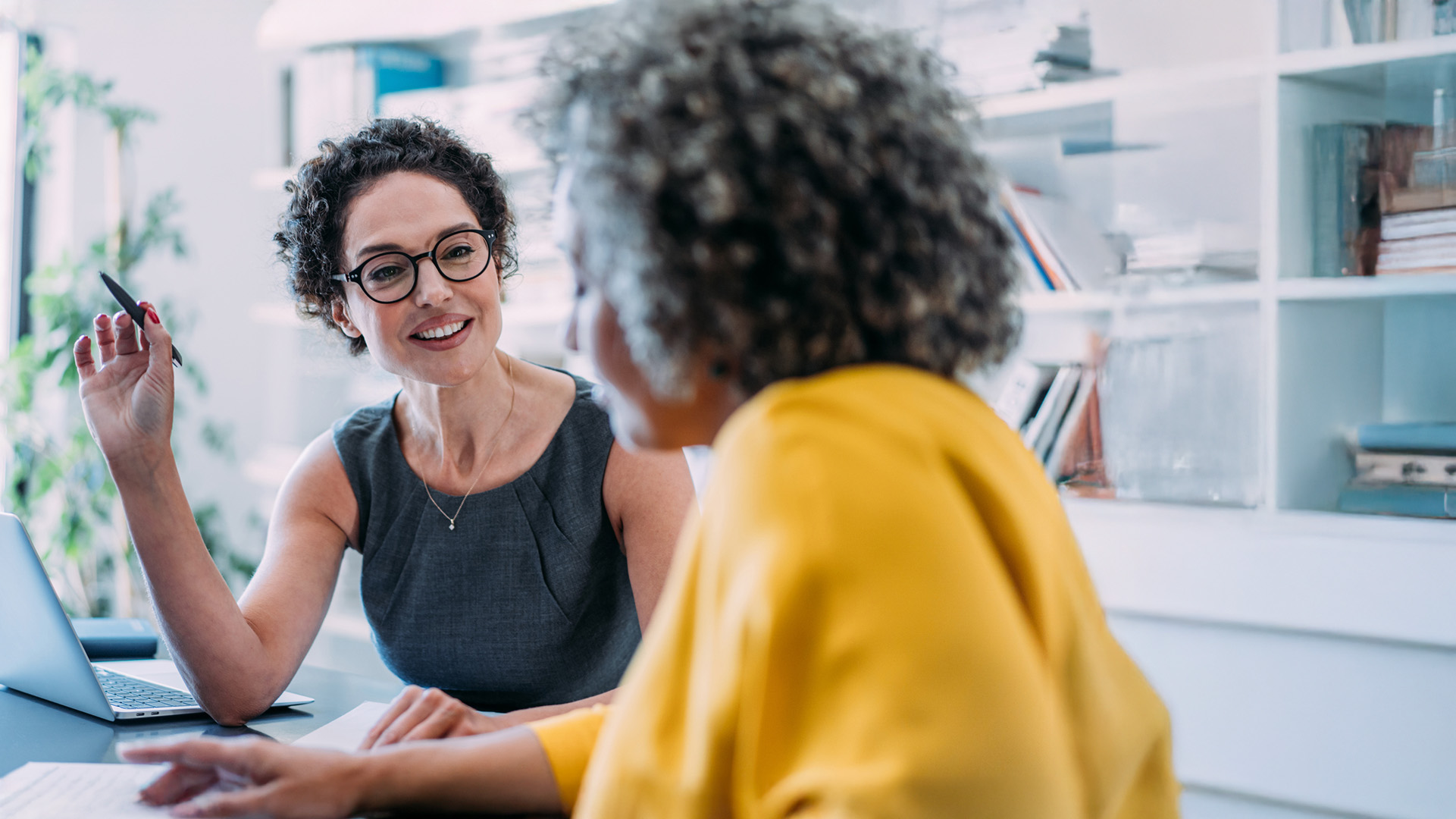 2 ladies working in an office setting