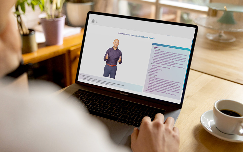 Person working through a course on special needs on a laptop