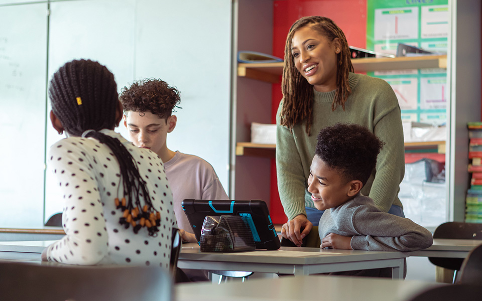 Teaching assistant with a group of students
