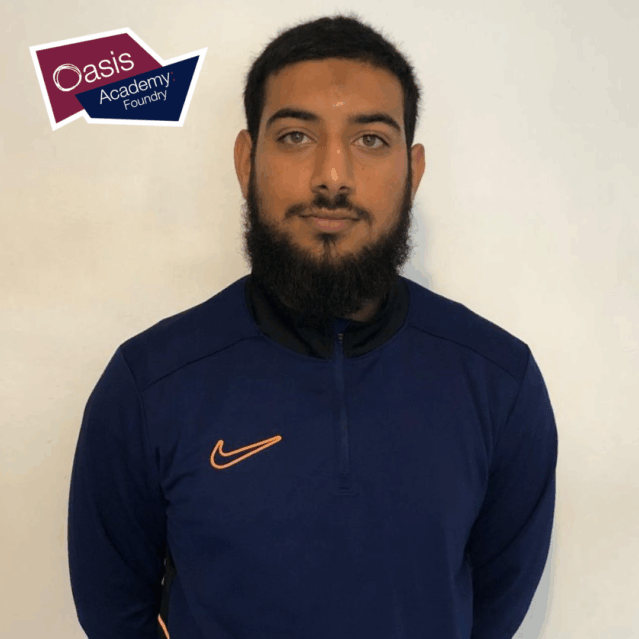 Muhammad wearing a sporty jumper smiling at the camera. The Oasis logo above him.